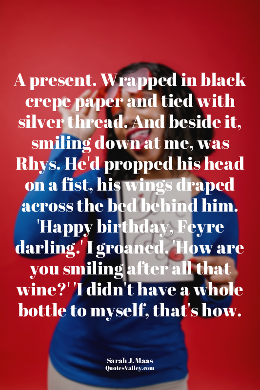 A present. Wrapped in black crepe paper and tied with silver thread. And beside...